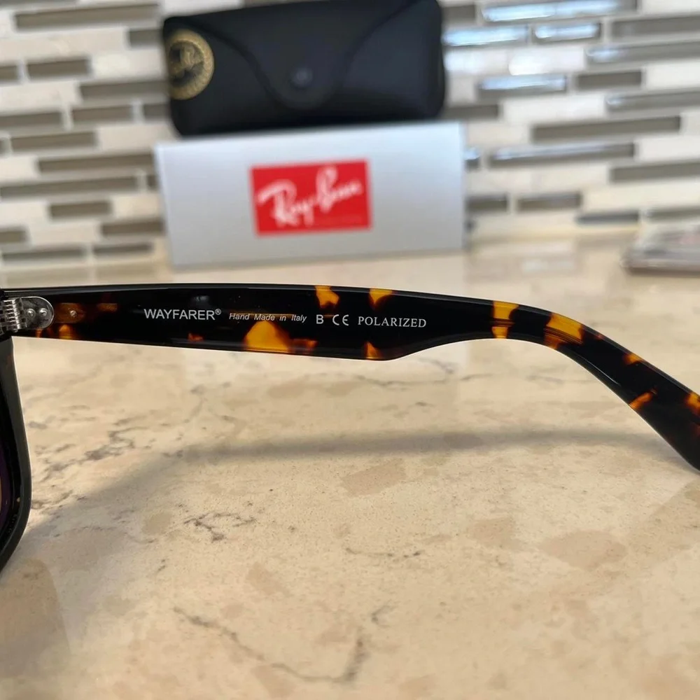 Ray-Ban Wayfarer Classic Black and Brown Polarized Sunglasses.